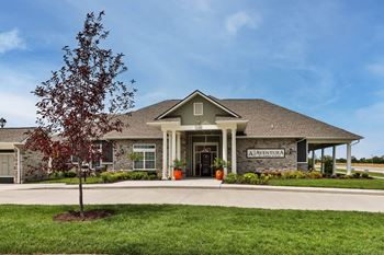 a large house with a tree in front of it  at Aventura at Hawk Ridge, Lake St Louis, MO, 63367